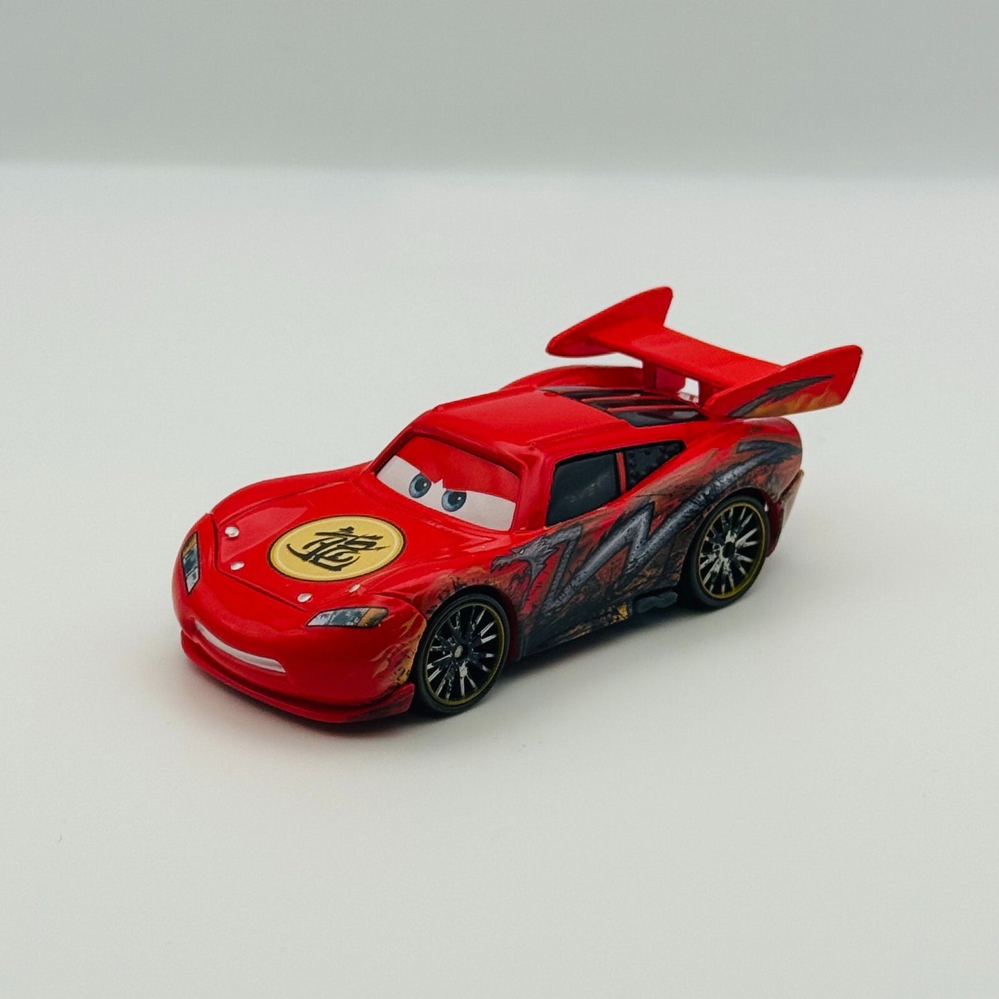 Disney Pixar Cars Toon - DRAGON MCQUEEN WITH OIL STAINS Tokyo Mater 1:55 Diecast
