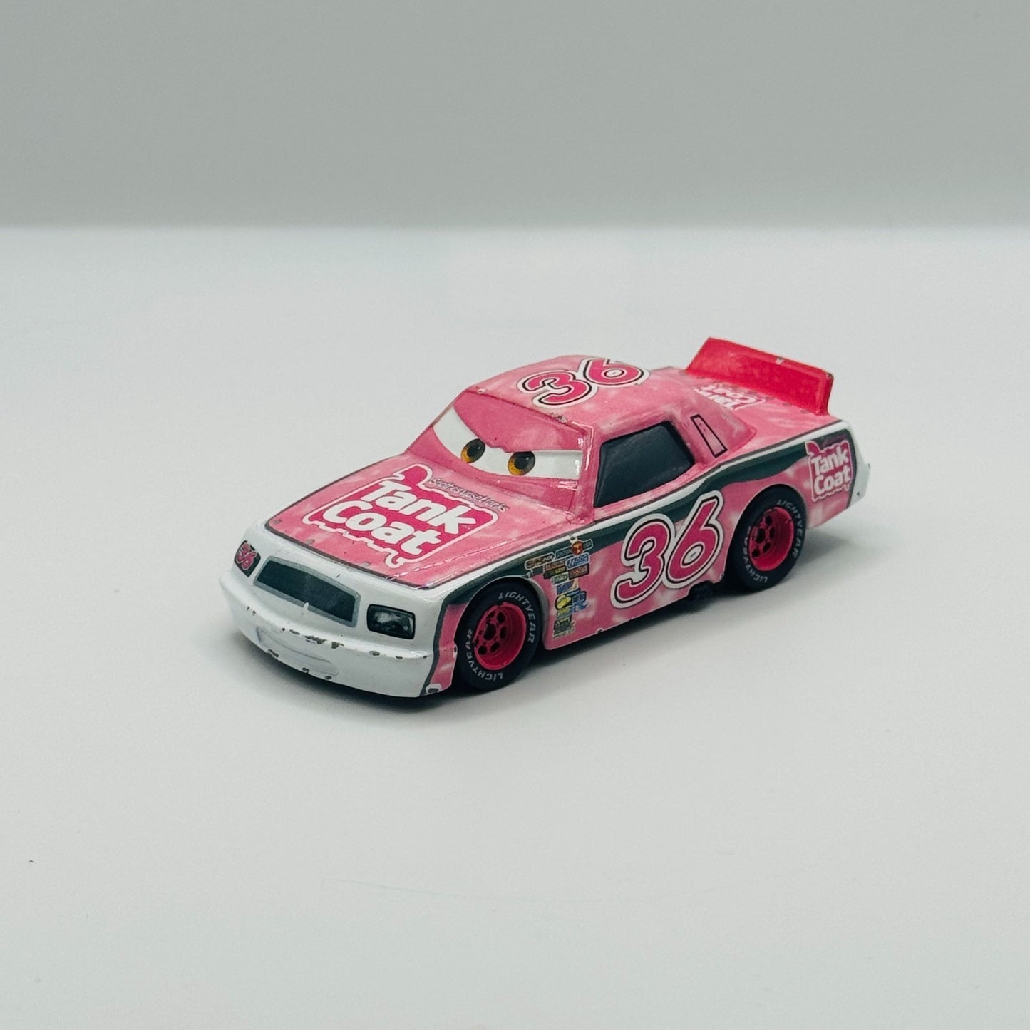 Disney Pixar Cars - EUGENE CARBURESKI TANK COAT Rubber Tires 2009 - 1:55 Diecast
