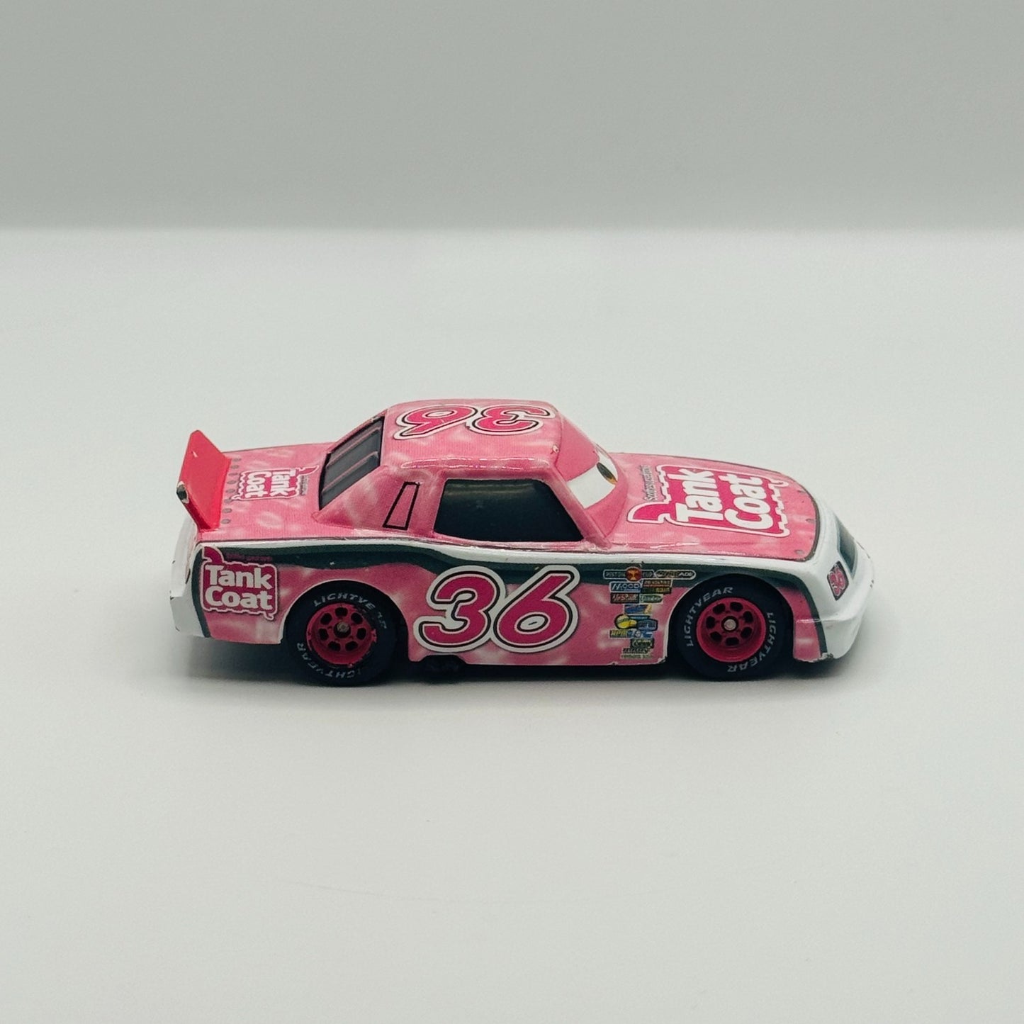 Disney Pixar Cars - EUGENE CARBURESKI TANK COAT Rubber Tires 2009 - 1:55 Diecast
