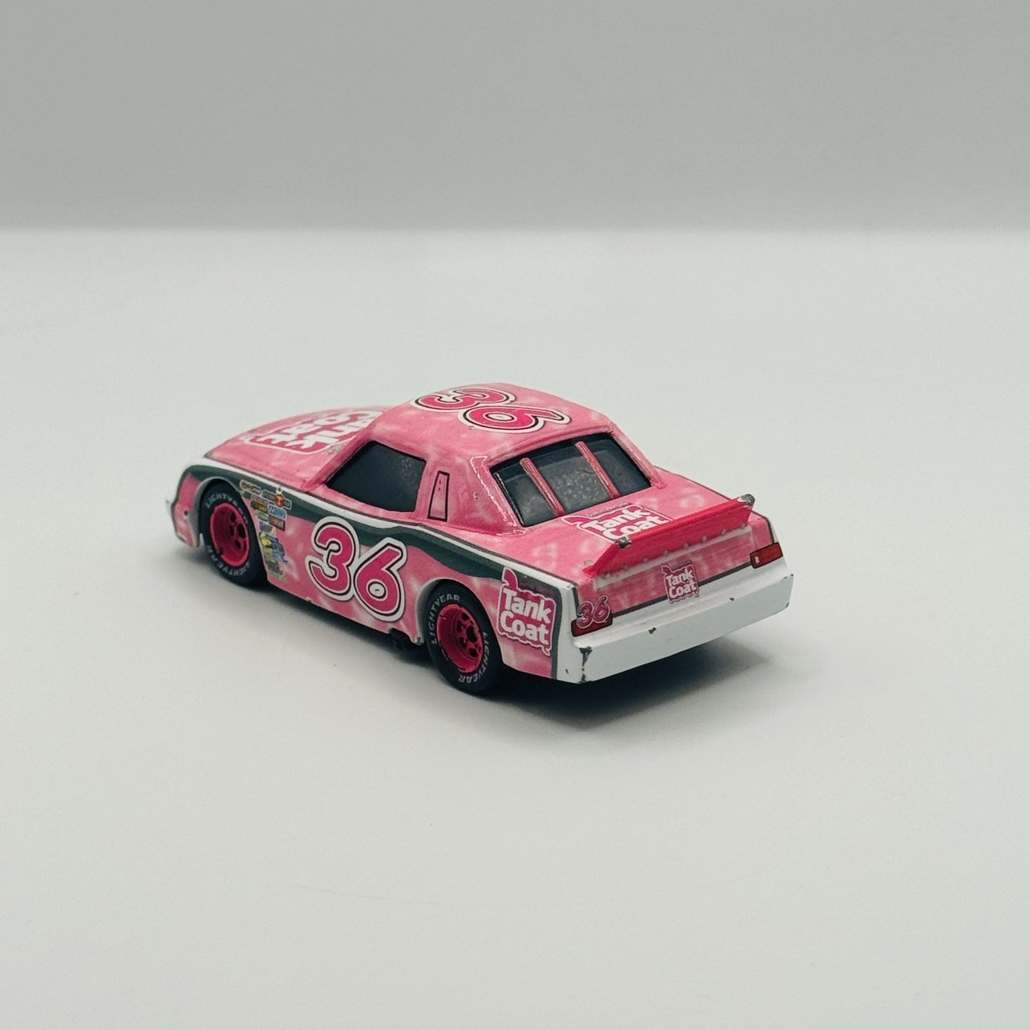 Disney Pixar Cars - EUGENE CARBURESKI TANK COAT Rubber Tires 2009 - 1:55 Diecast