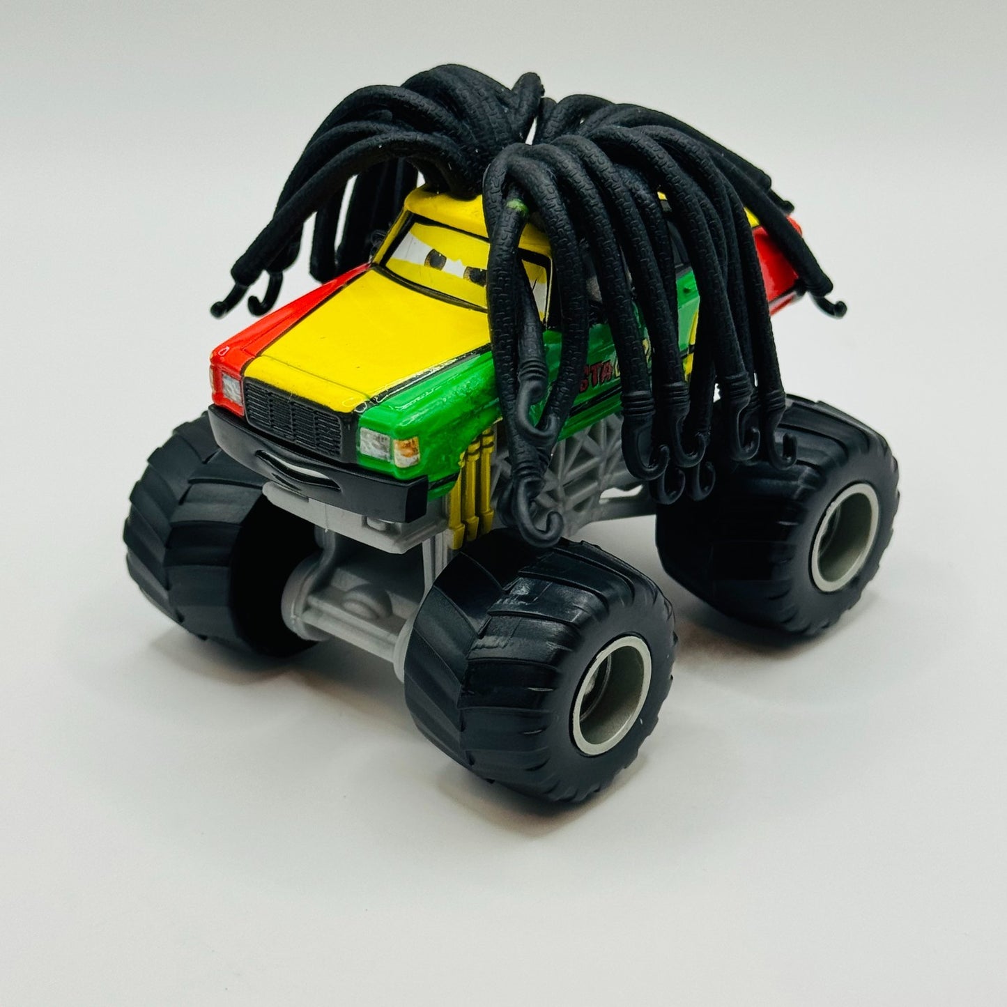 Disney Pixar Cars Toon - RASTA CARIAN Monster Truck Mater - 1:55 Diecast