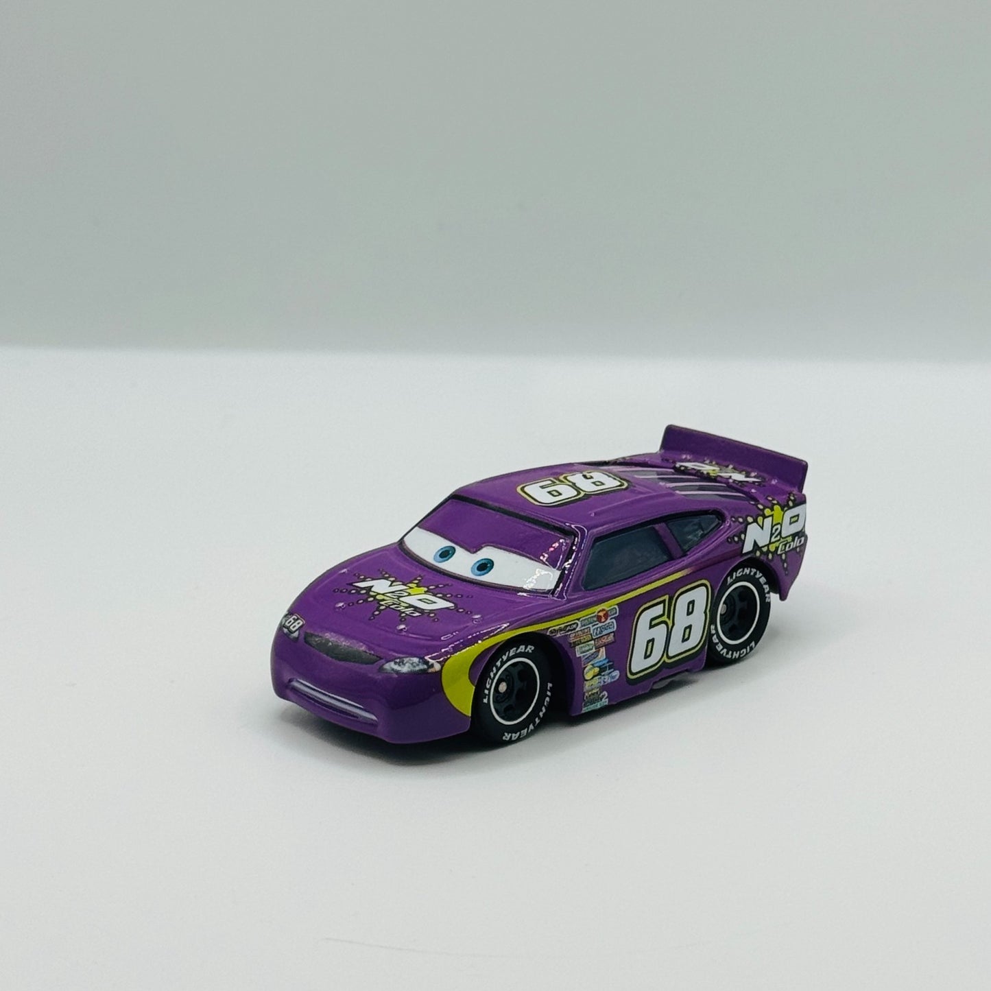 Disney Pixar Cars - N2O COLA MANNY FYWHEEL Rubber Tires Piston Cup -1:55 Diecast