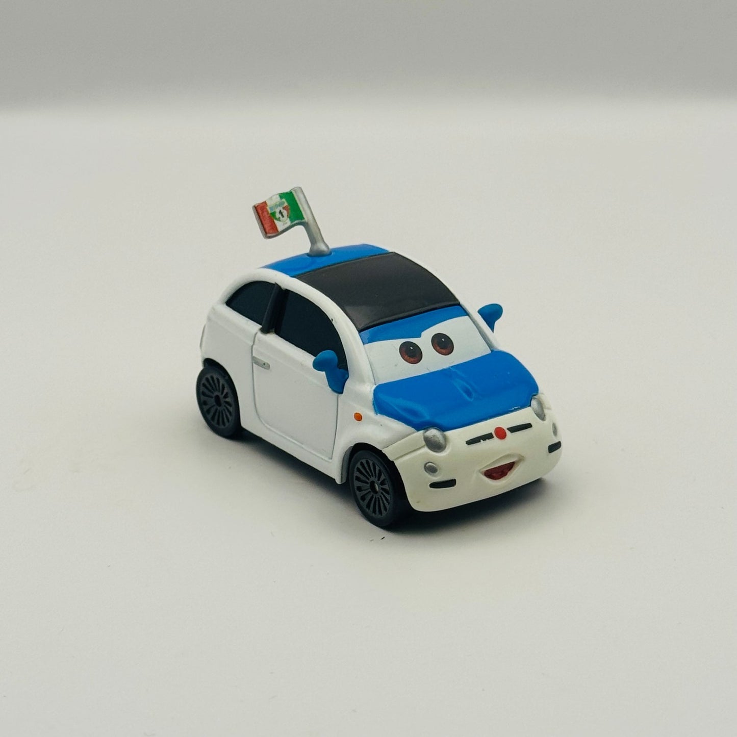 Disney Pixar Cars - FRANK CLUTCHENSON WGP Cars 2 Race Fan - 1:55 Diecast
