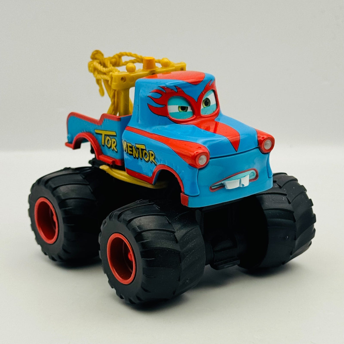 Disney Pixar Cars Toon - THE TORMENTOR Deluxe Monster Truck Mater - 1:55 Diecast
