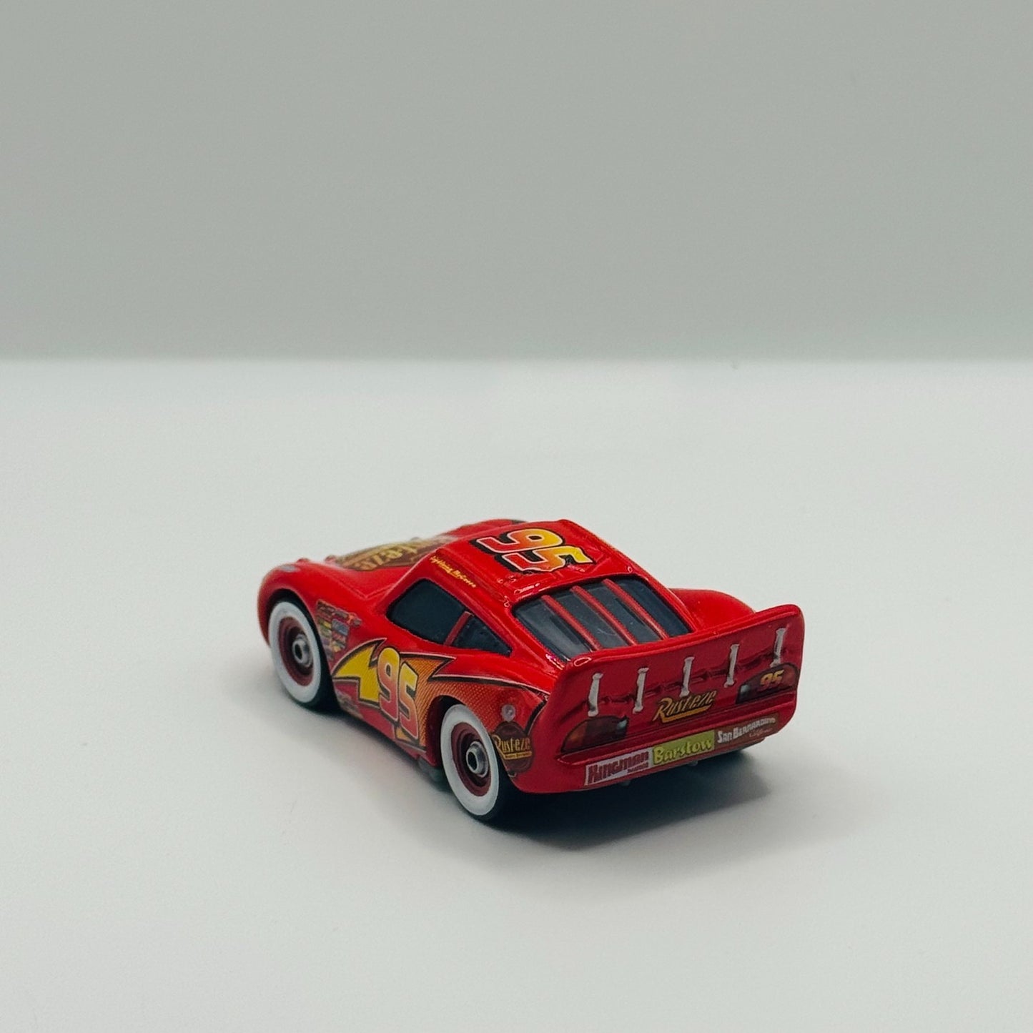 Disney Pixar Cars WHITEWALLS LIGHTNING MCQUEEN WITH BUMPER STICKER 1:55 Diecast