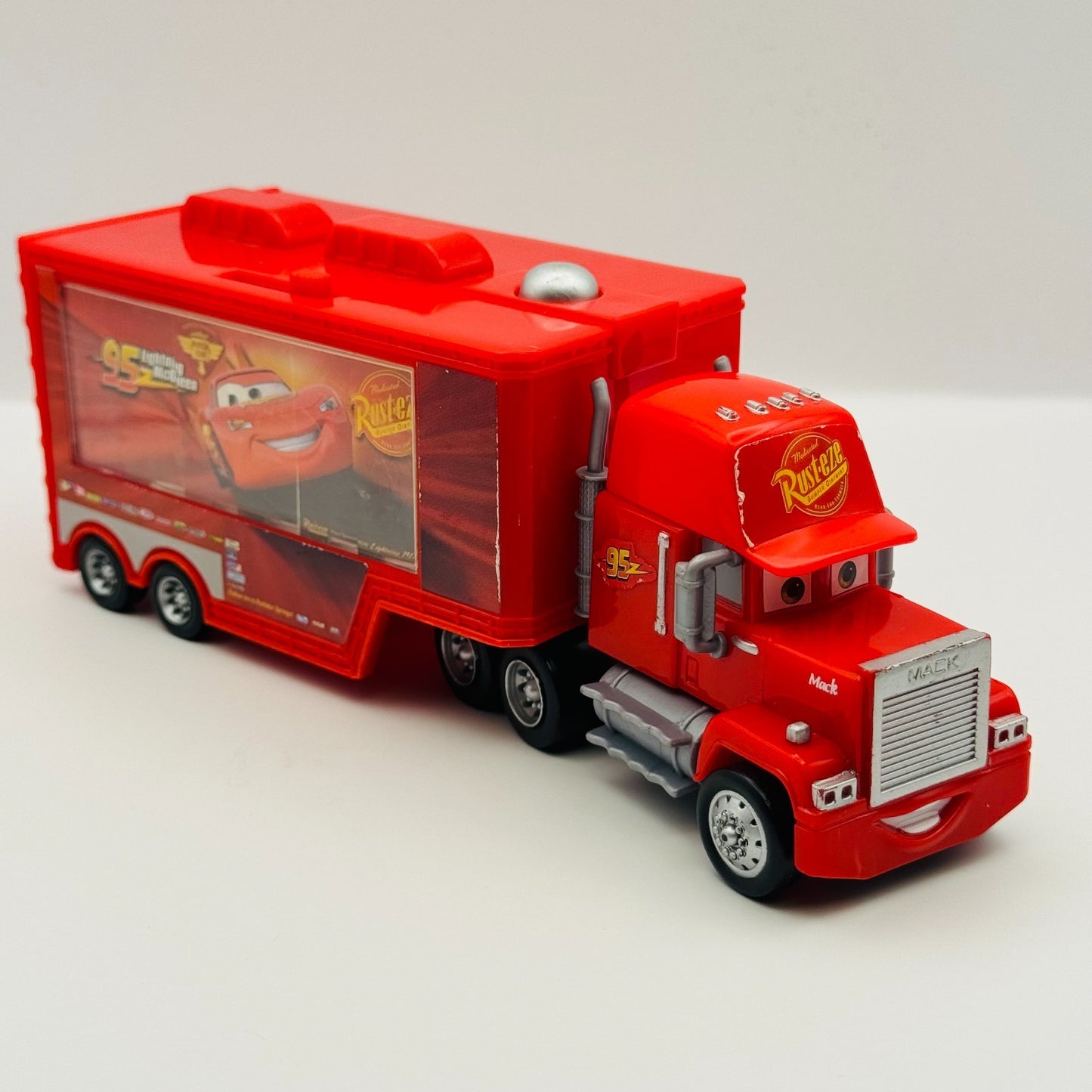 Disney Pixar Cars - QUICK CHANGERS DELUXE MACK TRANSPORTER CARS 2 - 1:55 Scale