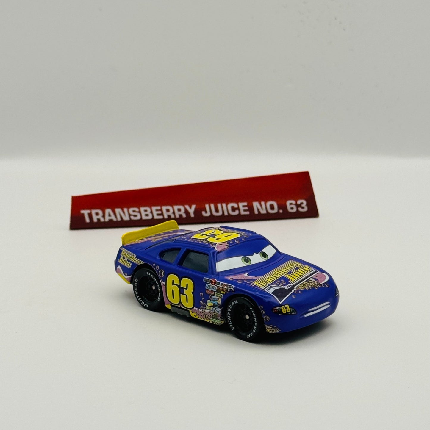 Disney Pixar Cars - TRANSBERRY JUICE LEE REVKINS Dinoco 2014 - 1:55 Diecast