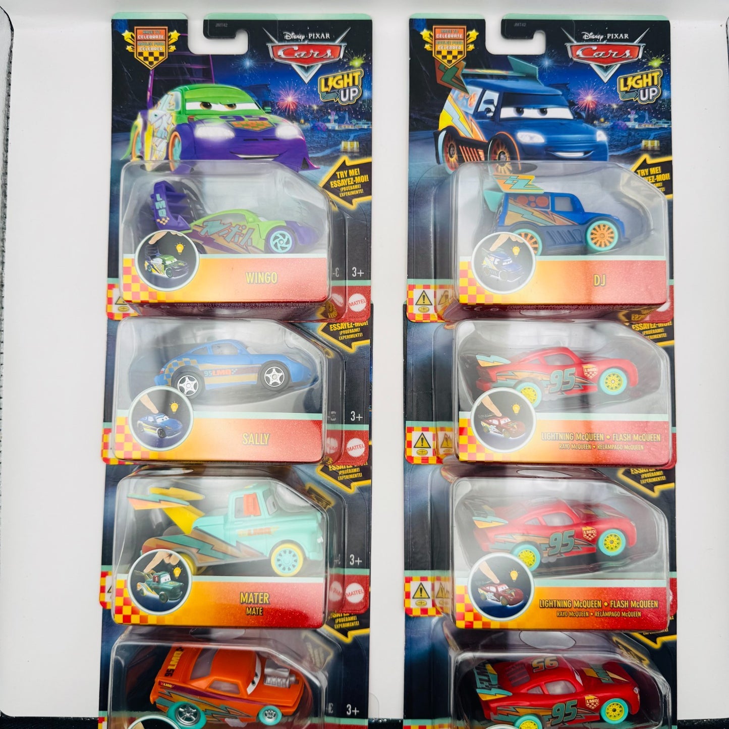 Disney Pixar Cars - RACE TO CELEBRATE LIGHT-UP COMPLETE 8 CAR CASE - 1:55 Scale
