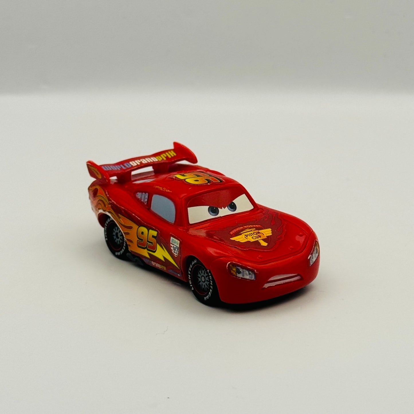 Disney Pixar Cars - DETERMINED WGP LIGHTNING MCQUEEN Cars 2 - 1:55 Scale Plastic
