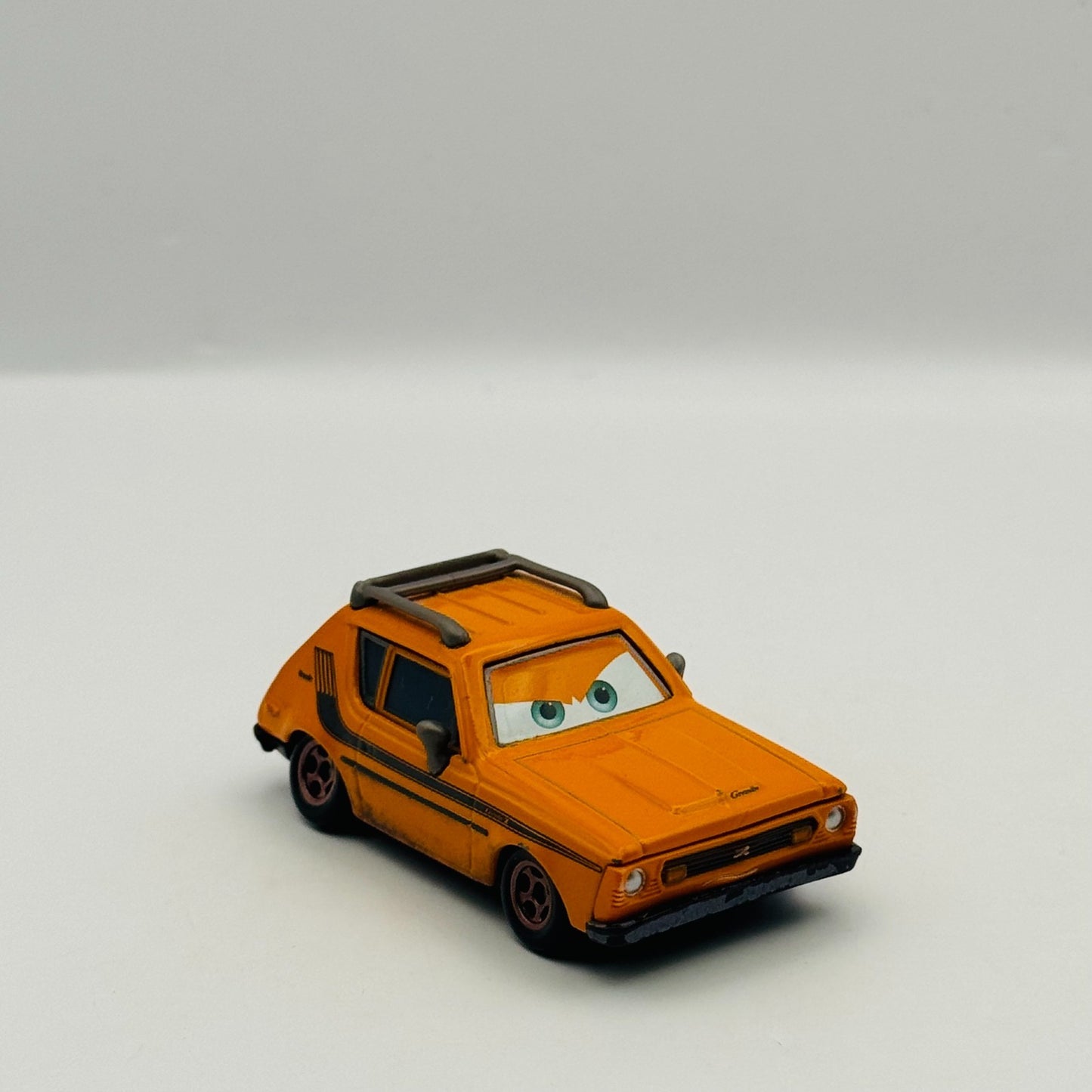 Disney Pixar Cars - GREM (AMC Gremlin) Lemons Cars 2 2011 - 1:55 Diecast