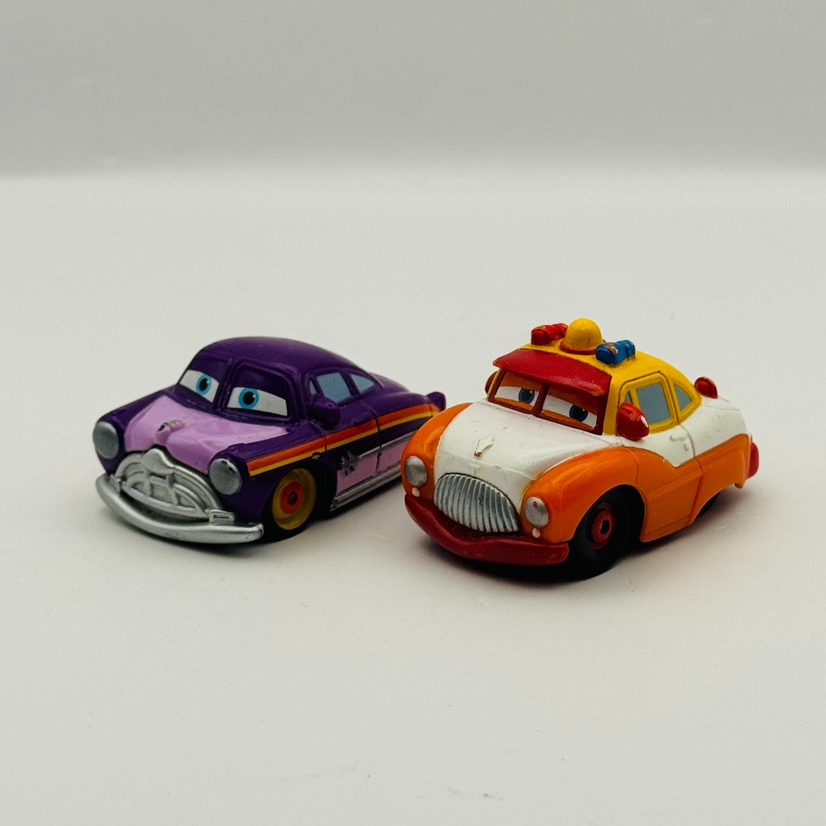 Disney Pixar Cars - Mini Adventures SHERIFF & PURPLE DOC - Fillmore's Festival