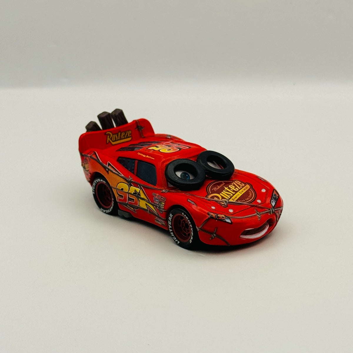 Disney Pixar Cars - SPIN OUT LIGHTNING MCQUEEN TIRE EYES - 1:55 Diecast