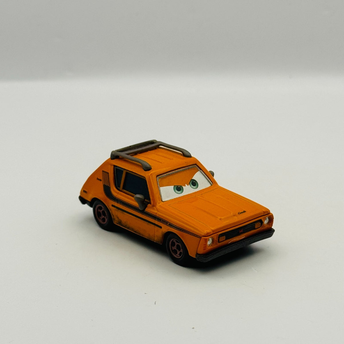 Disney Pixar Cars - GREM (AMC Gremlin) Lemons Cars 2 2011 - 1:55 Diecast