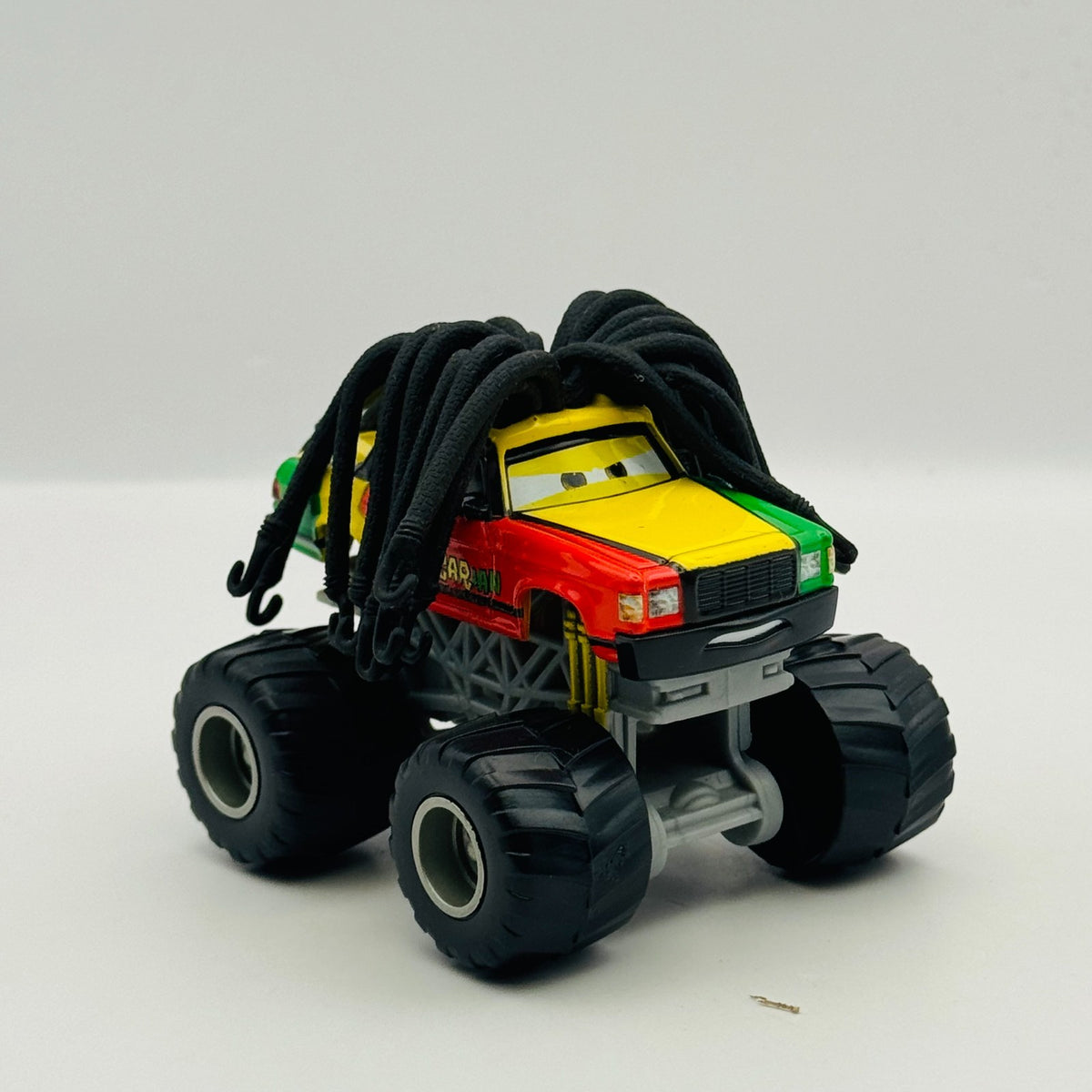 Disney Pixar Cars Toon - RASTA CARIAN Monster Truck Mater 2010 - 1:55 Diecast